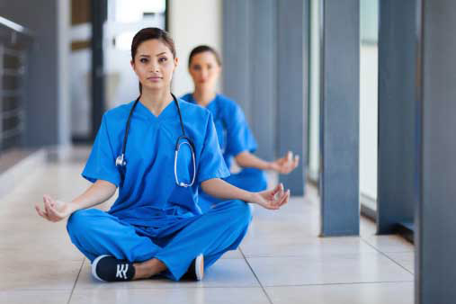 2 young female doctors stitting and deep breathing